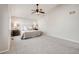 Inviting main bedroom featuring neutral decor, plush carpet, and a cozy ceiling fan at 11223 Jansen St, Parker, CO 80134
