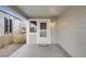 Inviting front porch with a covered entrance, a welcome mat, and wind chimes at 11223 Jansen St, Parker, CO 80134