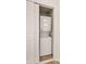 Convenient interior laundry closet includes a stacked washer and dryer unit at 17053 E Tennessee Dr # 101, Aurora, CO 80017