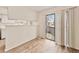 View of the doorway leading to the exterior fenced patio from the home's bright, light-filled living area at 17053 E Tennessee Dr # 101, Aurora, CO 80017