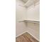 A walk-in closet featuring a clothes rod and shelf for organized storage solutions at 17053 E Tennessee Dr # 101, Aurora, CO 80017