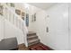 Entryway with stairs, a small table, and picture frames at 6405 S Dayton St # 105, Englewood, CO 80111