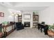 Living room with fireplace, bookcases, and a view to the entryway at 6405 S Dayton St # 105, Englewood, CO 80111