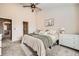 Cozy bedroom featuring soft neutral tones, carpet, and ceiling fan for added comfort at 1817 S Buchanan Cir, Aurora, CO 80018