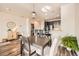 Dining area featuring a modern pendant light, a view of the kitchen, and stylish decor at 1817 S Buchanan Cir, Aurora, CO 80018