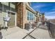 Inviting front porch with swing, comfortable seating, and a welcoming entrance at 1817 S Buchanan Cir, Aurora, CO 80018