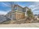Attached garage with brick accents and convenient driveway access in a residential neighborhood at 1817 S Buchanan Cir, Aurora, CO 80018