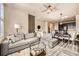 Open concept living room and dining area with plenty of natural light at 1817 S Buchanan Cir, Aurora, CO 80018