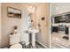Tastefully decorated powder room with pedestal sink and modern fixtures at 1817 S Buchanan Cir, Aurora, CO 80018
