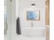Bright bathroom featuring a soaking tub with chrome fixtures and a window overlooking a wintery landscape at 1 Winged Foot Way, Littleton, CO 80123