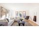 Bright living room featuring hardwood floors, large windows, and neutral decor at 1 Winged Foot Way, Littleton, CO 80123