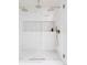 Stylish walk-in shower with white herringbone tile, mosaic niche, and three shower heads at 1 Winged Foot Way, Littleton, CO 80123