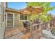 Enjoy outdoor dining on this back deck with seating, an umbrella, and a grill at 6731 E 128Th Pl, Thornton, CO 80602
