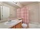 Bathroom with single sink vanity, toilet, tub, and shower at 6731 E 128Th Pl, Thornton, CO 80602