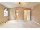 Spacious bedroom featuring neutral carpeting and access to an ensuite bathroom and walk-in closet at 6731 E 128Th Pl, Thornton, CO 80602