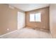 Bedroom featuring neutral walls, carpeting, and a double-door closet at 6731 E 128Th Pl, Thornton, CO 80602