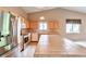 Spacious kitchen with stainless appliances, light wood cabinets, tile countertops, and hardwood floors at 6731 E 128Th Pl, Thornton, CO 80602