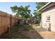 Backyard with wood fence and cut wood for burning at 1075 S Ames St, Lakewood, CO 80226