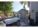 Backyard storage shed with disorganized yard at 1075 S Ames St, Lakewood, CO 80226