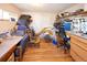 This craft room features hardwood floors, storage, natural light, and offers ample space to engage in your favorite hobby at 1075 S Ames St, Lakewood, CO 80226