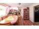 Warm dining room with hardwood floors, natural light, and a cozy atmosphere at 1075 S Ames St, Lakewood, CO 80226