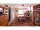 Inviting dining room with hardwood floors, ample natural light, and space for a dining table at 1075 S Ames St, Lakewood, CO 80226