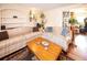 Comfortable living room with hardwood floors, a cozy seating area, and natural light at 1075 S Ames St, Lakewood, CO 80226
