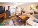 Cozy living room with hardwood floors, comfortable seating, and a decorative fireplace at 1075 S Ames St, Lakewood, CO 80226