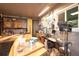 This workshop features a drill press, peg board, and built in cabinets for convenient storage at 1075 S Ames St, Lakewood, CO 80226