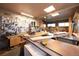 A bright and spacious workshop with various power tools, ample counter space, and built-in storage at 1075 S Ames St, Lakewood, CO 80226