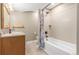 Cozy bathroom featuring a shower-tub combo, framed mirror, and vanity with storage at 1122 Orion Way, Castle Rock, CO 80108
