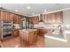 Well-appointed kitchen featuring a center island, stainless steel appliances, and modern finishes at 1122 Orion Way, Castle Rock, CO 80108