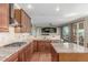 Gourmet kitchen with granite countertops, stainless steel appliances, and custom cabinetry at 1122 Orion Way, Castle Rock, CO 80108
