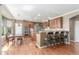 Modern kitchen features a breakfast bar, stainless steel appliances, and abundant cabinet space at 1122 Orion Way, Castle Rock, CO 80108