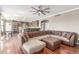 Spacious living space seamlessly connects to a modern kitchen with hardwood floors and ample seating at 1122 Orion Way, Castle Rock, CO 80108