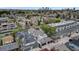 Aerial view showcasing the neighborhood and city skyline in the distance, surrounded by mature trees at 520 Columbine St, Denver, CO 80206