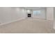 Spacious basement featuring neutral carpet, a fireplace, and a window at 520 Columbine St, Denver, CO 80206
