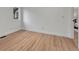 Cozy bedroom featuring new wood floors and ample natural light from a window at 520 Columbine St, Denver, CO 80206