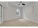 Bright bedroom featuring neutral carpet, a ceiling fan and a window providing natural light at 520 Columbine St, Denver, CO 80206