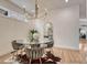 Elegant dining space features modern decor, unique light fixture, and a stylish glass table at 520 Columbine St, Denver, CO 80206