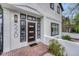 Close-up of a modern entryway featuring a stylish front door with sidelights and a brick landing at 520 Columbine St, Denver, CO 80206