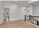 Bright hallway features wood floors, neutral walls and natural light from a skylight at 520 Columbine St, Denver, CO 80206