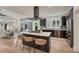 Modern kitchen boasts a large island with seating, sleek black cabinets, and stainless steel appliances at 520 Columbine St, Denver, CO 80206