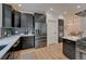 Kitchen with stainless appliances, including a refrigerator, modern fixtures, and lots of cabinet space at 520 Columbine St, Denver, CO 80206