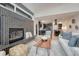 Cozy living room with modern fireplace, open layout, seamless flow to the kitchen, and neutral decor at 520 Columbine St, Denver, CO 80206