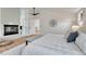 Cozy and comfortable main bedroom with fireplace, ceiling fan, and light wood floors at 520 Columbine St, Denver, CO 80206