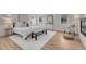 Bright main bedroom features wood floors, natural light, and seating area at 520 Columbine St, Denver, CO 80206