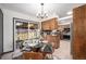 Charming kitchen featuring an island and an adjacent dining space with backyard view at 6298 S Harlan Way, Littleton, CO 80123