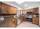 Modern kitchen featuring stainless steel appliances, granite countertops, and custom cabinets at 6298 S Harlan Way, Littleton, CO 80123