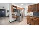 Spacious kitchen with stainless steel appliances, granite counter tops, and custom cabinets at 6298 S Harlan Way, Littleton, CO 80123